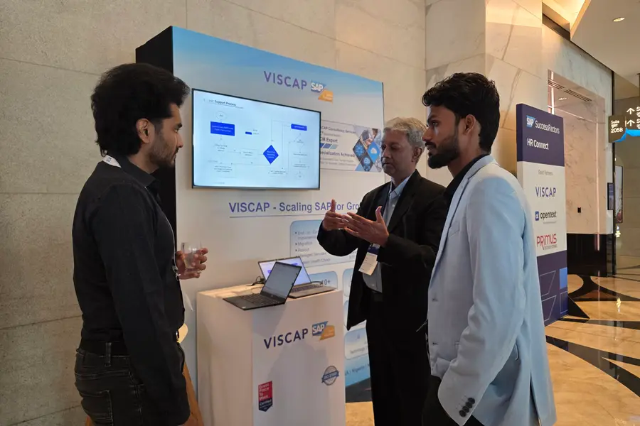 Visitors in conversation with the VISCAP team at the stand.