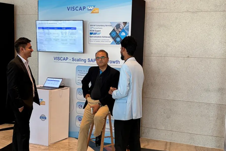 A conversation beside the VISCAP stand at HR Connect Mumbai.
