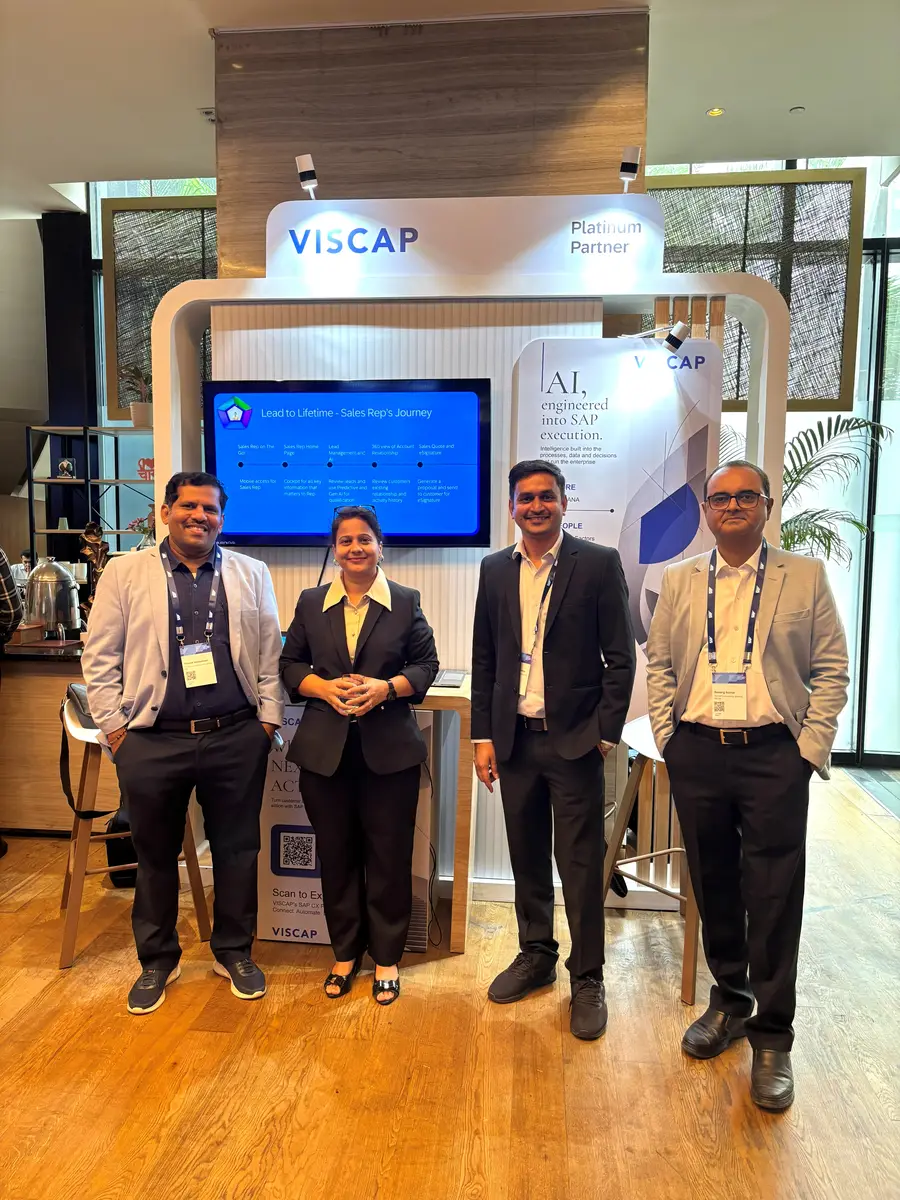 The VISCAP team with colleagues at the stand, in front of the Awareness to Action screen.