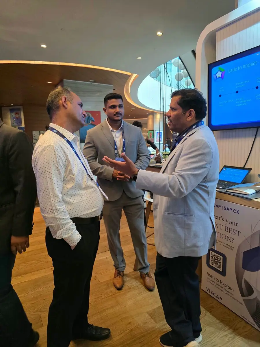 VISCAP colleagues in conversation with visitors on the partner floor.